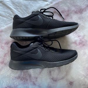 Women’s black Nike sneakers